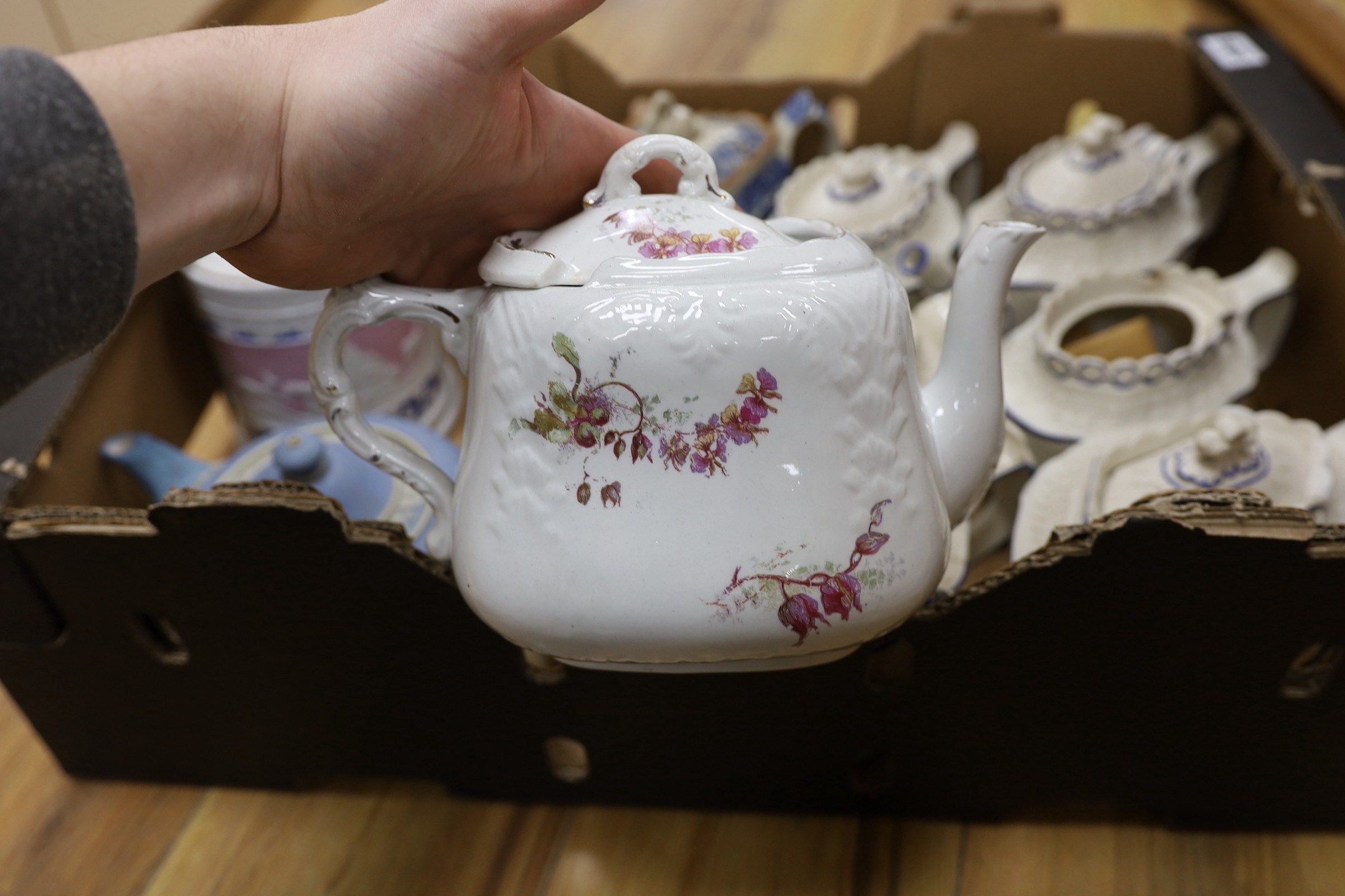 A quantity of various teapots including a pearlware teapot with swan finial, Castleford types, one Wedgwood